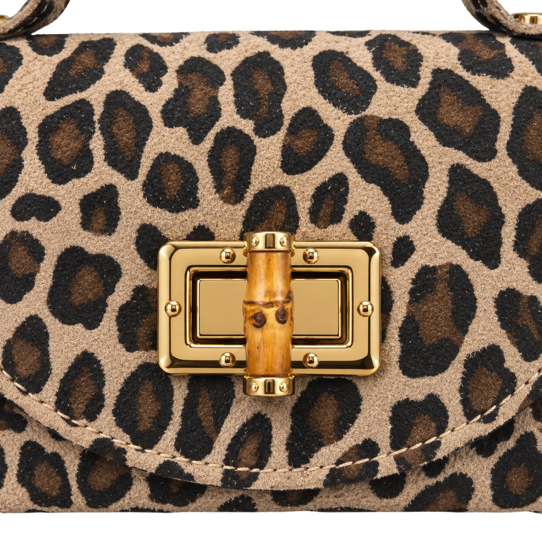Borsa donna in vera pelle maculata, chiusura in bambù e tracolla Made in Italy